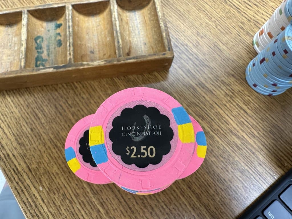 Close-up of rounded edges and edge wear on a heavily used casino chip